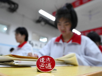 Senior three students, who are about to take the National College entrance examination, are studying by themselves at night at Fengfeng No 1...