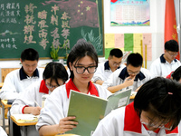 Senior three students, who are about to take the National College entrance examination, are studying by themselves at night at Fengfeng No 1...