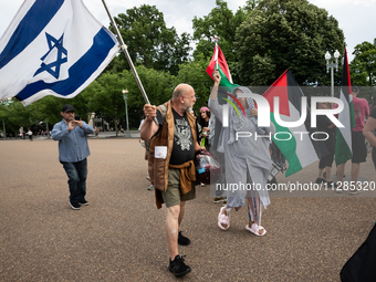 A Christian counter-protester with an Israeli flag tries unsuccessfully to provoke a fight with hundreds of people protesting in front of th...