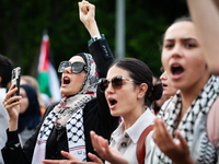 People chant slogans in front of the White House during a protest against the Israeli attacks on civilians in Rafah that have killed dozens...