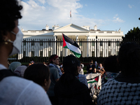 A Palestinian flag is displayed in front of the White House during a protest against the Israeli attacks on civilians in Rafah that have kil...