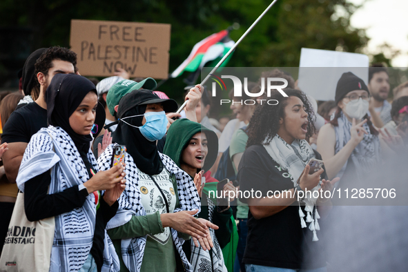 Demonstrators chant slogans in front of the White House during a protest against the Israeli attacks on civilians in Rafah that have killed...