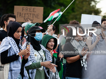 Demonstrators chant slogans in front of the White House during a protest against the Israeli attacks on civilians in Rafah that have killed...