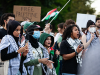 Demonstrators chant slogans in front of the White House during a protest against the Israeli attacks on civilians in Rafah that have killed...