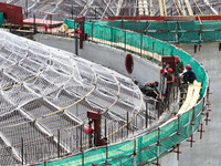 Workers are working at the construction site of a grain storage project of the Yandu branch of the Central Grain Reserve Yancheng Direct War...