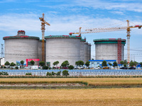 Workers are working at the construction site of a grain storage project of the Yandu branch of the Central Grain Reserve Yancheng Direct War...