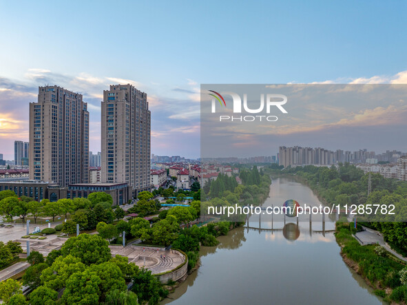 A photo is showing the North-South Geographical Boundary indication Garden in the Chaoxia district of Huai'an City, Jiangsu province, China,...