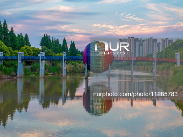 A photo is showing the North-South Geographical Boundary indication Garden in the Chaoxia district of Huai'an City, Jiangsu province, China,...