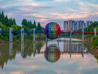 A photo is showing the North-South Geographical Boundary indication Garden in the Chaoxia district of Huai'an City, Jiangsu province, China,...