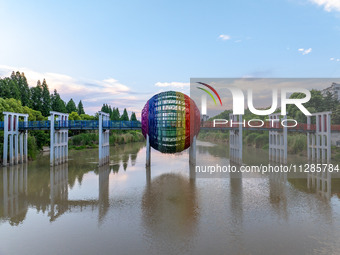 A photo is showing the North-South Geographical Boundary indication Garden in the Chaoxia district of Huai'an City, Jiangsu province, China,...