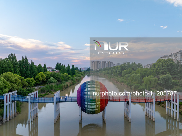 A photo is showing the North-South Geographical Boundary indication Garden in the Chaoxia district of Huai'an City, Jiangsu province, China,...