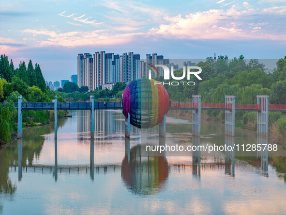 A photo is showing the North-South Geographical Boundary indication Garden in the Chaoxia district of Huai'an City, Jiangsu province, China,...