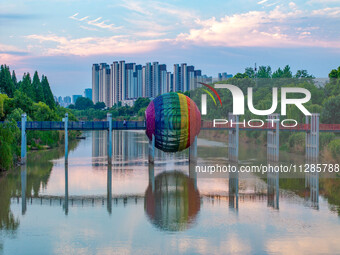 A photo is showing the North-South Geographical Boundary indication Garden in the Chaoxia district of Huai'an City, Jiangsu province, China,...