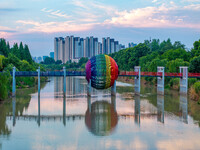 A photo is showing the North-South Geographical Boundary indication Garden in the Chaoxia district of Huai'an City, Jiangsu province, China,...