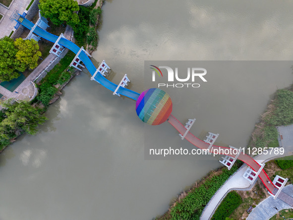 A photo is showing the North-South Geographical Boundary indication Garden in the Chaoxia district of Huai'an City, Jiangsu province, China,...