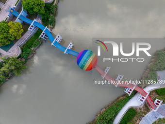 A photo is showing the North-South Geographical Boundary indication Garden in the Chaoxia district of Huai'an City, Jiangsu province, China,...