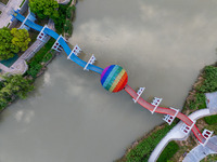 A photo is showing the North-South Geographical Boundary indication Garden in the Chaoxia district of Huai'an City, Jiangsu province, China,...