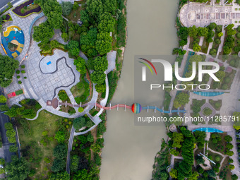 A photo is showing the North-South Geographical Boundary indication Garden in the Chaoxia district of Huai'an City, Jiangsu province, China,...