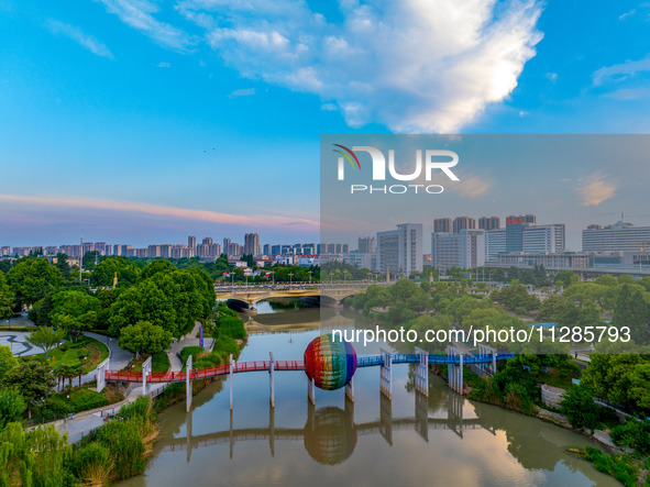 A photo is showing the North-South Geographical Boundary indication Garden in the Chaoxia district of Huai'an City, Jiangsu province, China,...