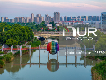 A photo is showing the North-South Geographical Boundary indication Garden in the Chaoxia district of Huai'an City, Jiangsu province, China,...