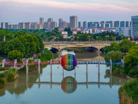 A photo is showing the North-South Geographical Boundary indication Garden in the Chaoxia district of Huai'an City, Jiangsu province, China,...