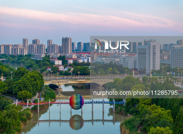 A photo is showing the North-South Geographical Boundary indication Garden in the Chaoxia district of Huai'an City, Jiangsu province, China,...