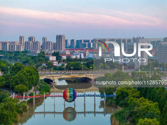 A photo is showing the North-South Geographical Boundary indication Garden in the Chaoxia district of Huai'an City, Jiangsu province, China,...