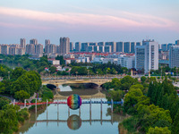 A photo is showing the North-South Geographical Boundary indication Garden in the Chaoxia district of Huai'an City, Jiangsu province, China,...