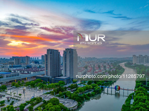 A photo is showing the North-South Geographical Boundary indication Garden in the Chaoxia district of Huai'an City, Jiangsu province, China,...