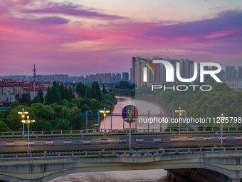 A photo is showing the North-South Geographical Boundary indication Garden in the Chaoxia district of Huai'an City, Jiangsu province, China,...