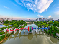 A photo is showing the North-South Geographical Boundary indication Garden in the Chaoxia district of Huai'an City, Jiangsu province, China,...