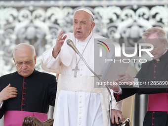 Pope Francis is blessing the crowd at the end of his Wednesday general audience in St. Peter's Square at the Vatican, on May 29, 2024. (