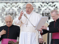 Pope Francis is blessing the crowd at the end of his Wednesday general audience in St. Peter's Square at the Vatican, on May 29, 2024. (