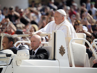 Pope Francis is greeting the faithful as he arrives to lead his Wednesday general audience in St. Peter's Square at the Vatican, on May 29,...