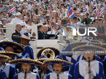 Pope Francis is greeting the faithful as he is arriving to lead his Wednesday general audience in St Peter's Square at the Vatican, on May 2...