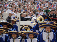 Pope Francis is greeting the faithful as he is arriving to lead his Wednesday general audience in St Peter's Square at the Vatican, on May 2...