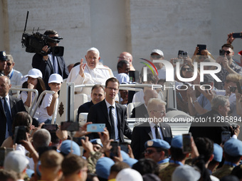 Pope Francis is greeting the faithful as he arrives to lead his Wednesday general audience in St. Peter's Square at the Vatican, on May 29,...