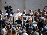 Pope Francis is greeting the faithful as he arrives to lead his Wednesday general audience in St. Peter's Square at the Vatican, on May 29,...