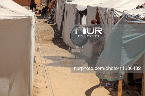 Displaced Palestinians are being seen among the tents in Deir el-Balah in the central Gaza Strip on May 29, 2024, amid the ongoing conflict...