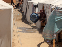 Displaced Palestinians are being seen among the tents in Deir el-Balah in the central Gaza Strip on May 29, 2024, amid the ongoing conflict...