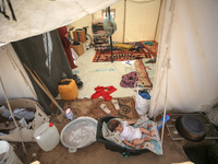 Displaced Palestinians are being seen among the tents in Deir el-Balah in the central Gaza Strip on May 29, 2024, amid the ongoing conflict...