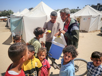 A vendor is selling ice cream at a camp for displaced Palestinians in Deir el-Balah in the central Gaza Strip on May 29, 2024, amid the ongo...