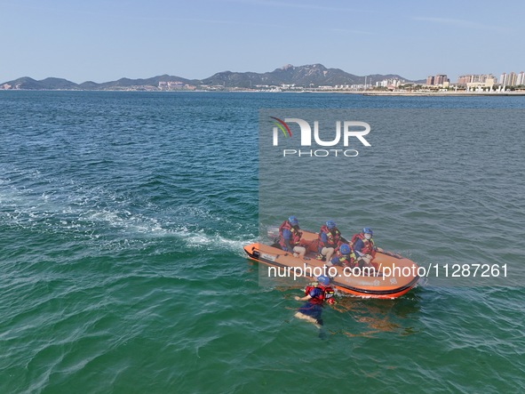 Rescuers are conducting a training to rescue drowning at sea in Yantai, China, on May 29, 2024. 