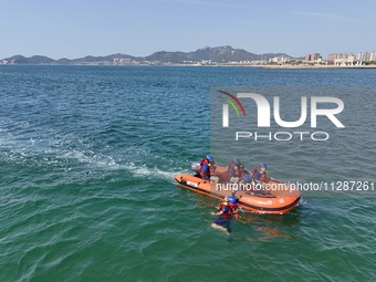 Rescuers are conducting a training to rescue drowning at sea in Yantai, China, on May 29, 2024. (