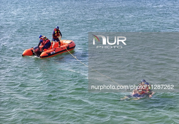 Rescuers are conducting a training to rescue drowning at sea in Yantai, China, on May 29, 2024. 