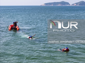 Rescuers are conducting a training to rescue drowning at sea in Yantai, China, on May 29, 2024. (