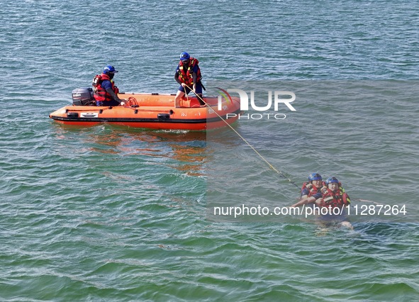 Rescuers are conducting a training to rescue drowning at sea in Yantai, China, on May 29, 2024. 