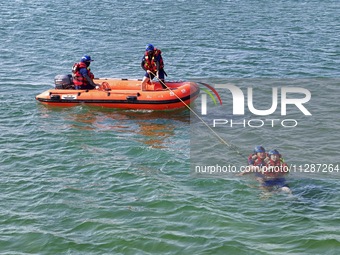 Rescuers are conducting a training to rescue drowning at sea in Yantai, China, on May 29, 2024. (