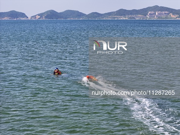 Rescuers are conducting a training to rescue drowning at sea in Yantai, China, on May 29, 2024. 