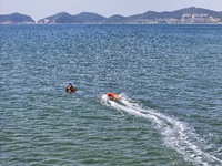 Rescuers are conducting a training to rescue drowning at sea in Yantai, China, on May 29, 2024. (